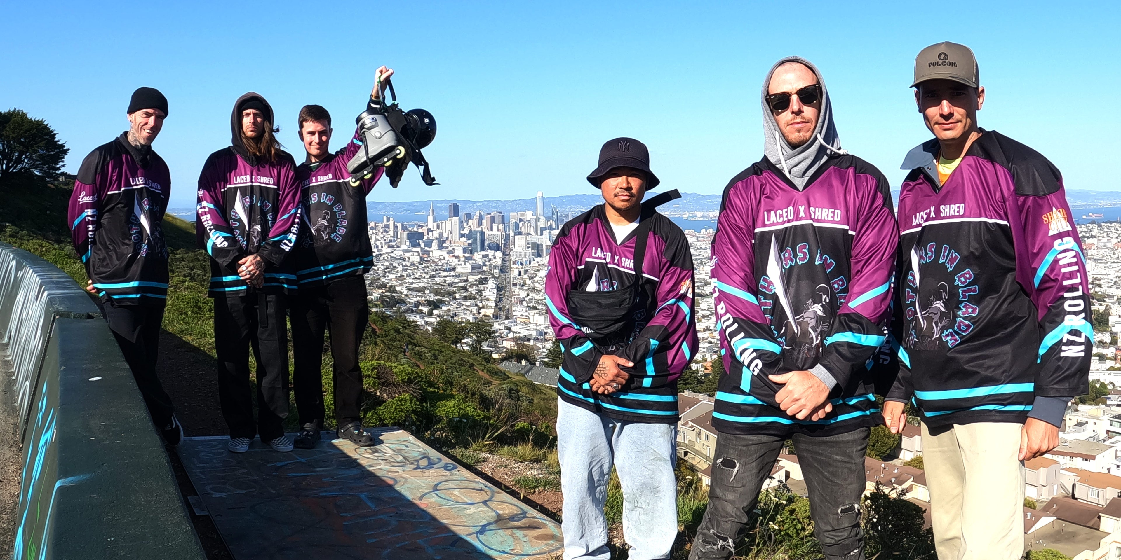 6 Kiwi boys wearing matching Hockey jerseys in front of San Fransico city.